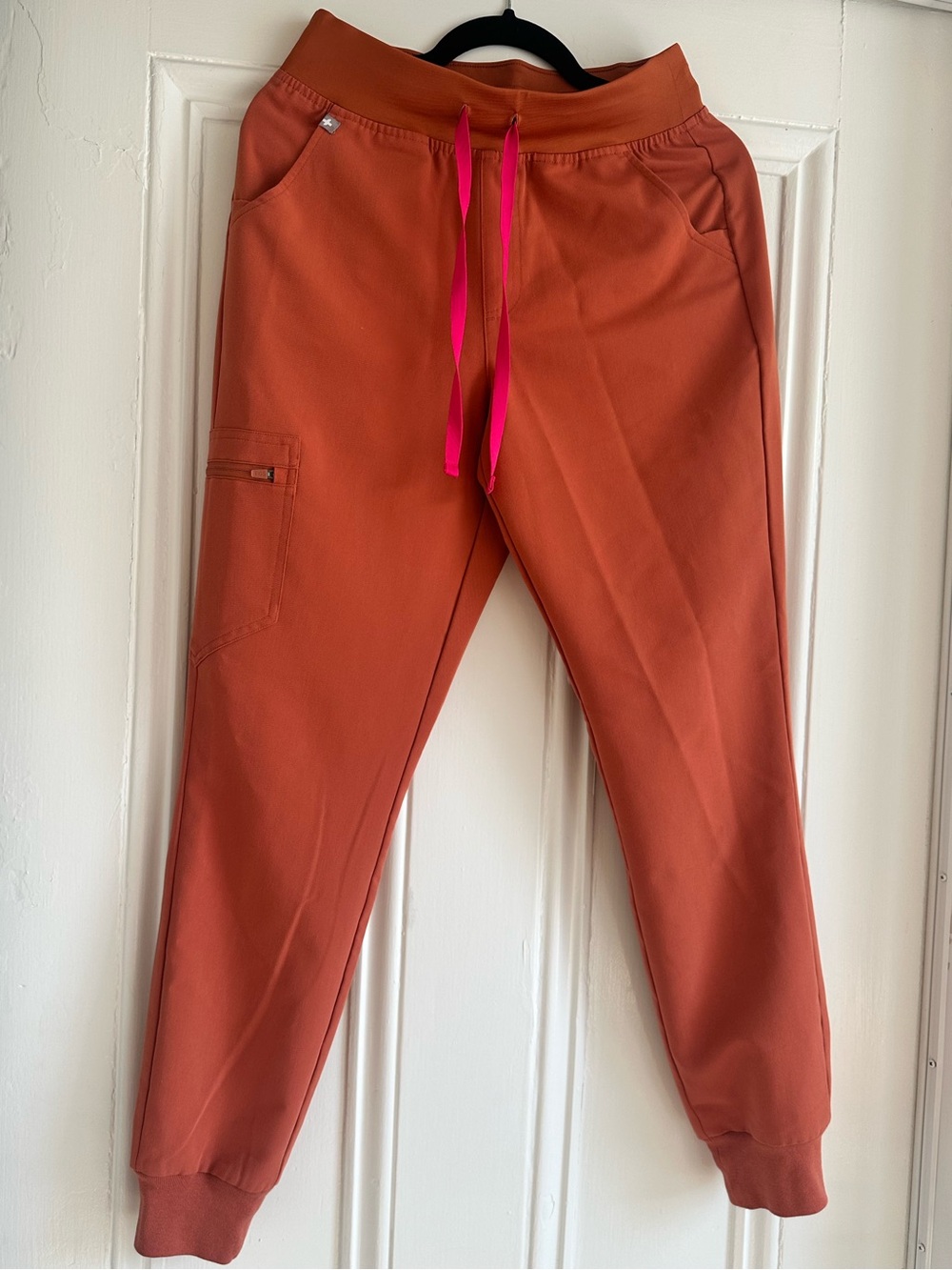 Women's figs jogger scrub bottoms. Size small in an orange color.